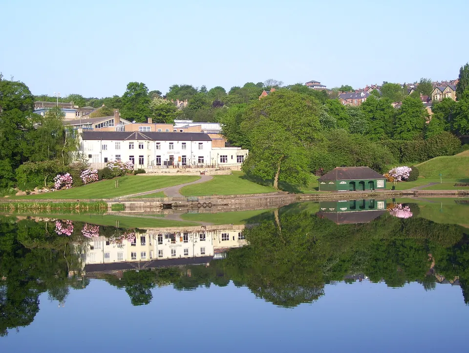 The lake with Dam House reflected in the water, Crookes Valley Park