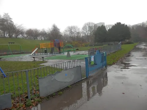 The fenced children's play area and its gate, Crookes Valley Park